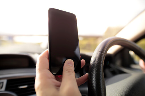 Holding a cellphone while driving