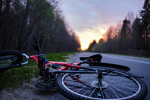 The bike lies on the roadway