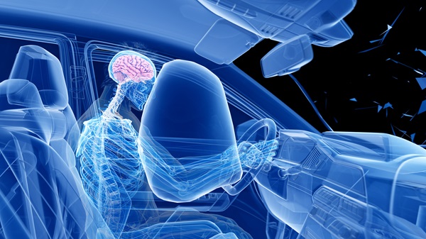 A 3D blue-tinted anatomical illustration showing a driver's skeleton impacting a deployed airbag, with the brain highlighted in pink to demonstrate the internal movement during a New Hampshire car accident.